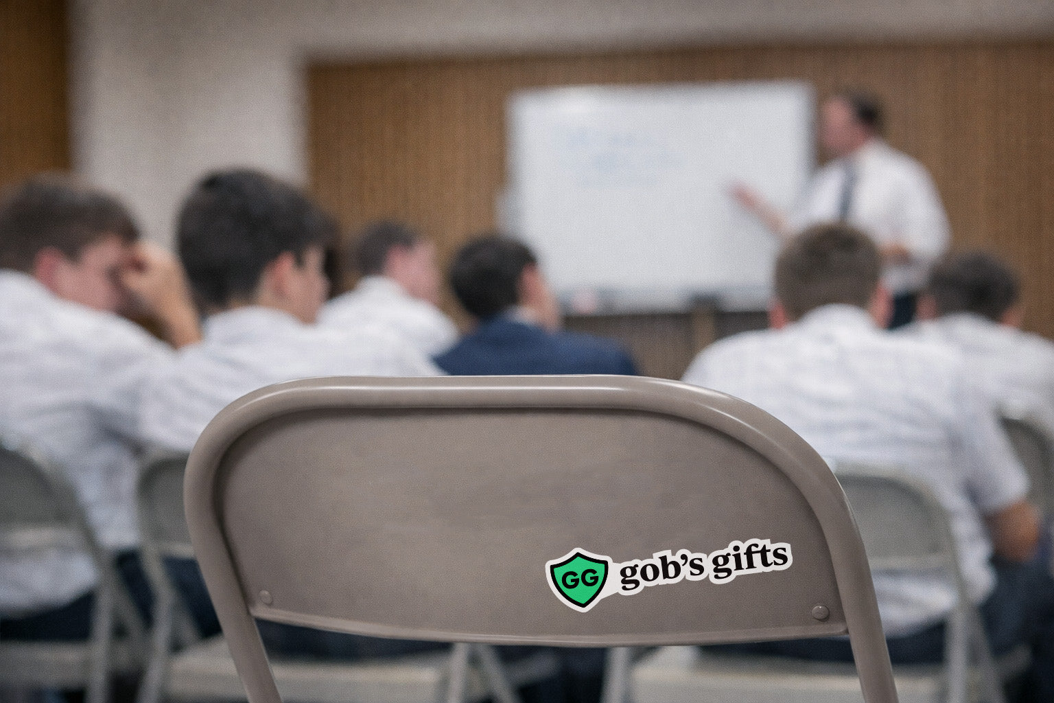 Chair with 'gob's gifts' logo in a blurred Sunday School setting